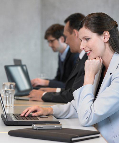 businesswoman-using-laptop-smiling-2021-11-08-22-51-31-utc.jpg